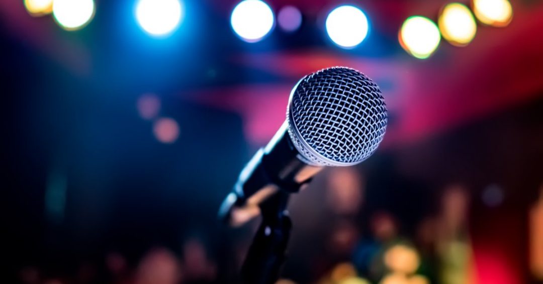 Photo of a microphone on a stage
