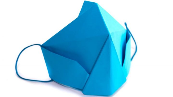 A blue origami face mask
