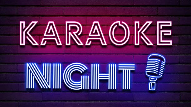 Neon sign that says Karaoke Night with a microphone.