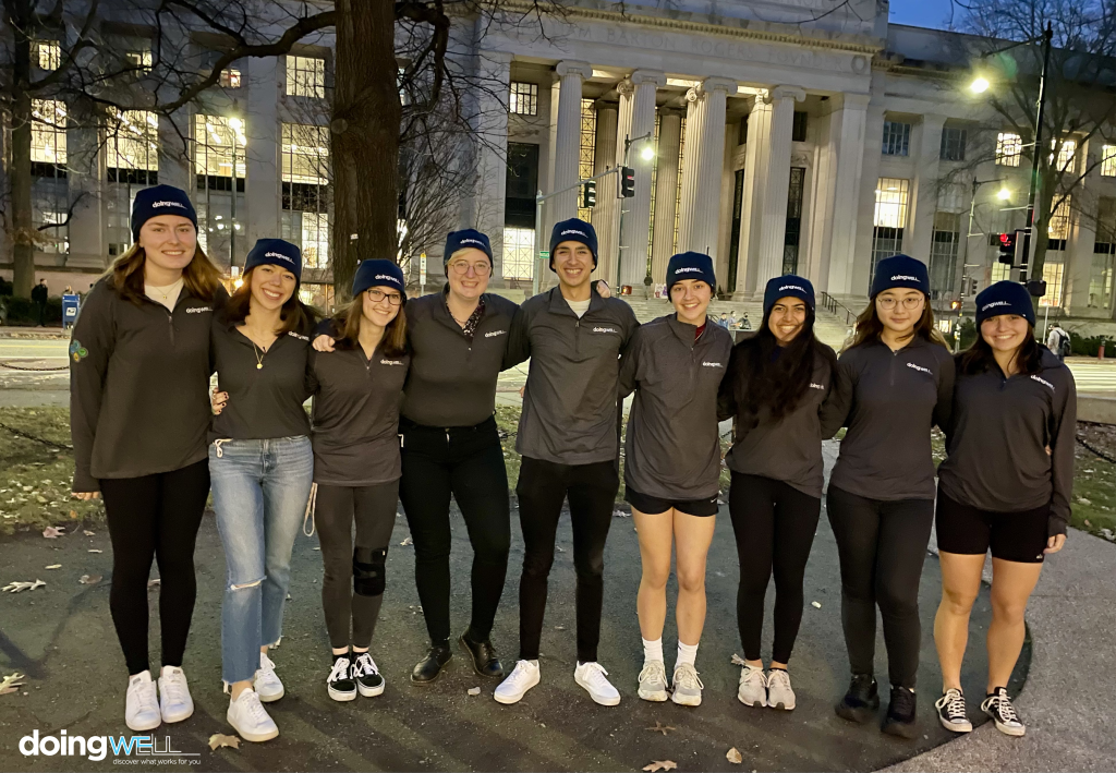 Group photo of the Wellbeing Ambassadors outside the steps of Building 7.